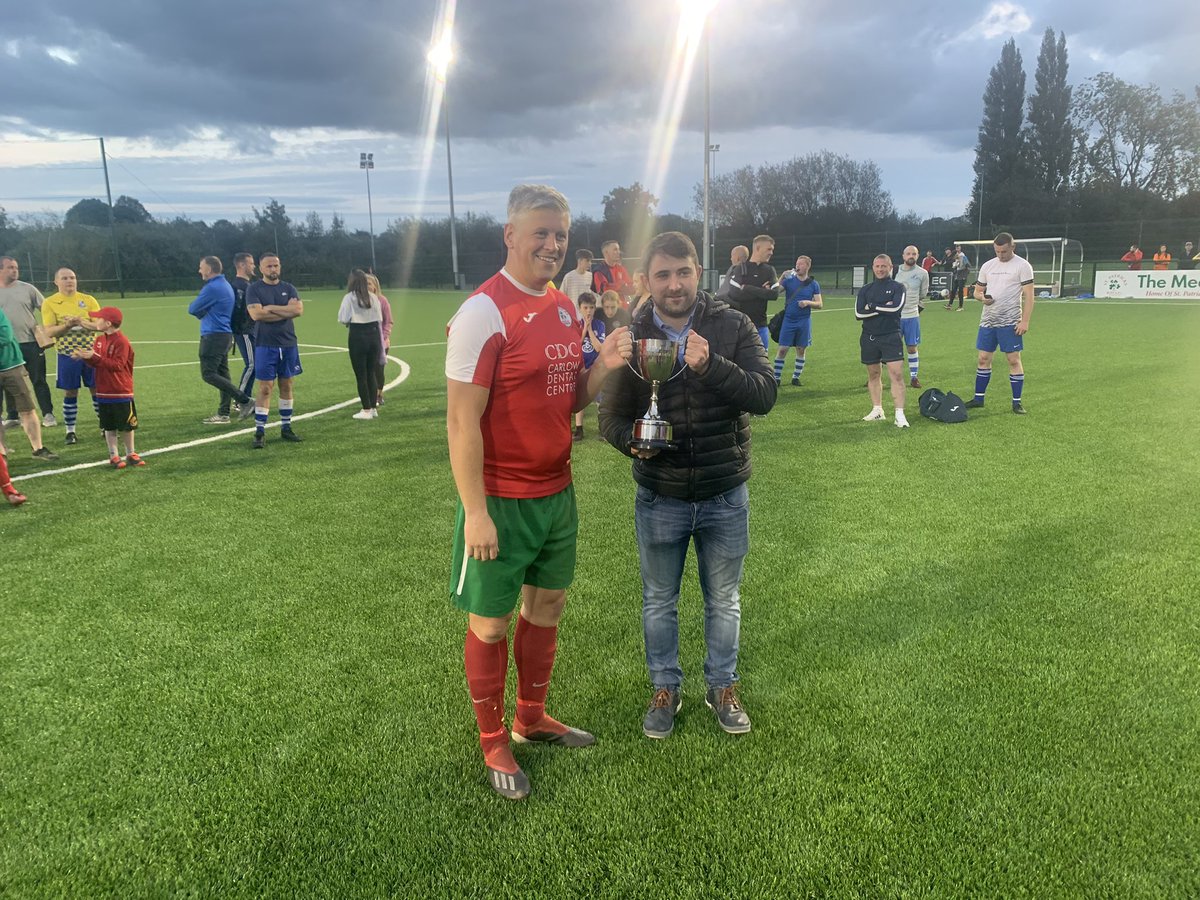 CarlowSoccer's tweet photo. We have our Mullins Memorial cup winners @PatsAfc who beat @StFiaccsFC four nil. Michael Mullins presents the player of the match to Brian Maguire and Martin Mullins presents the Martin Mullins cup to John O Neill captain https://t.co/srGkiGWwWf