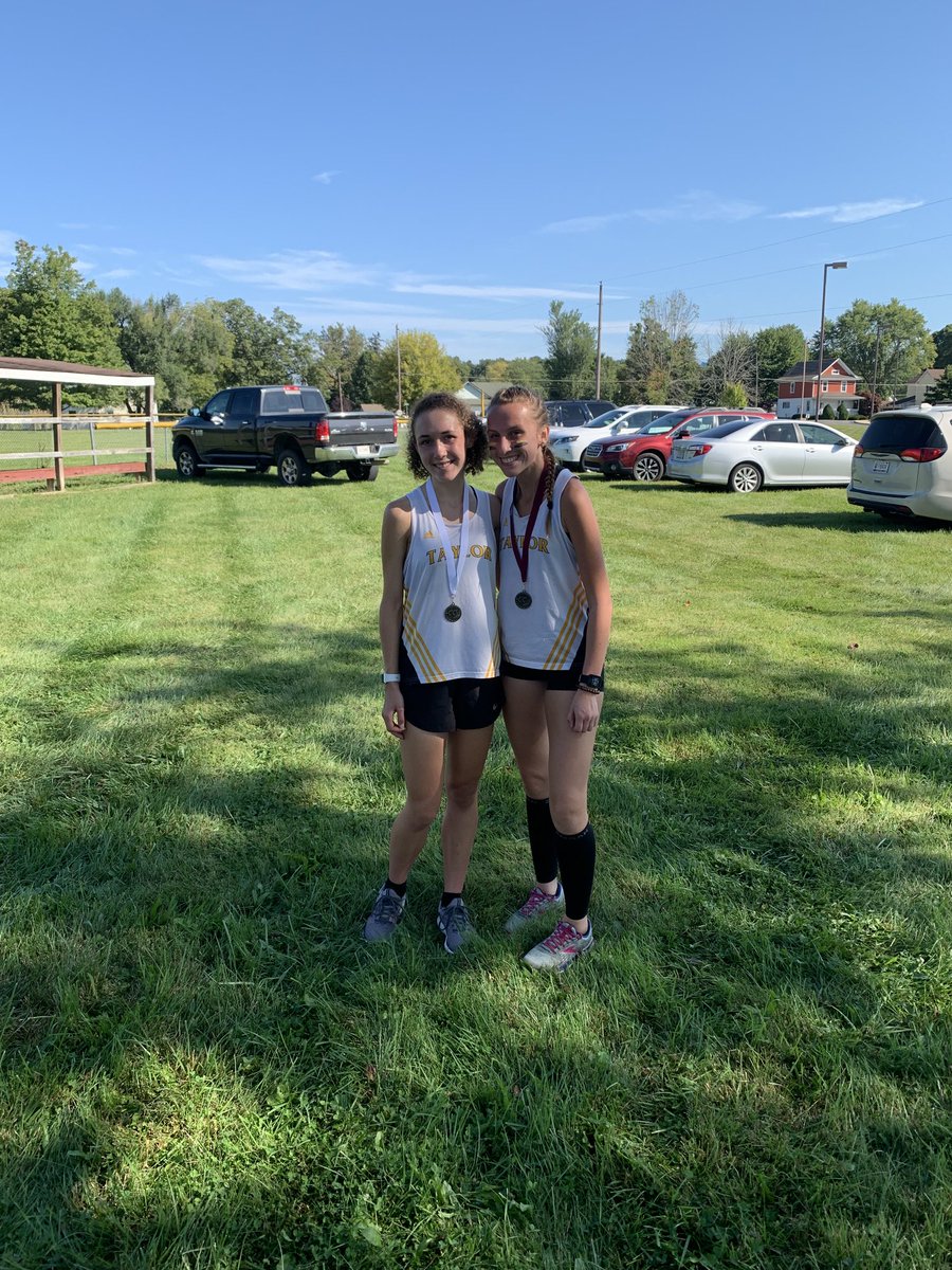 Monica Dart and Mya Bross with their third and ninth place medals at the South Dearborn Invitational.