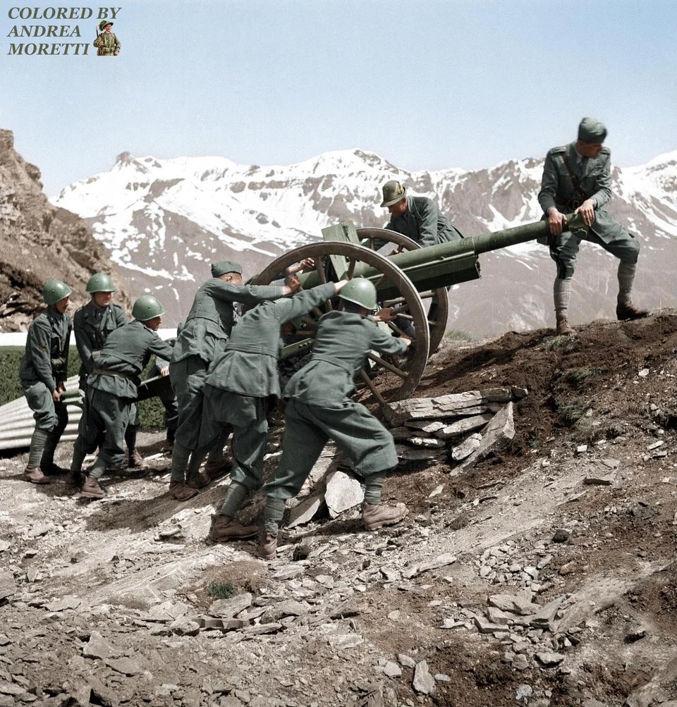 Historybench's tweet image. Italian soldiers on the Alps place a piece of artillery. Western Front 1940