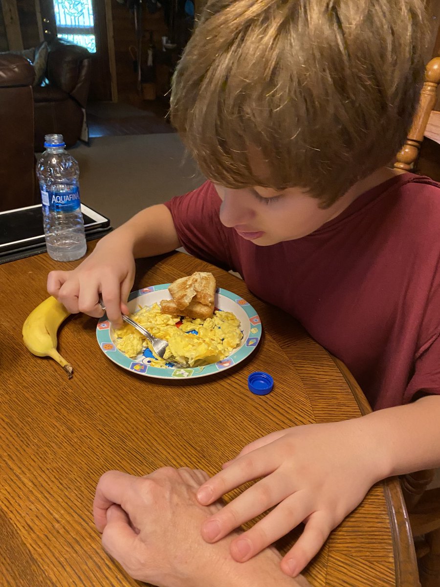 We’ve had some behavior regression, likely due to seasonal change. My son with #autism requires physical contact to perform tasks. Here, he’s unable to eat without holding my hand. Last year, due to this behavior he couldn’t walk through a doorway or get out of the car w/o touch.