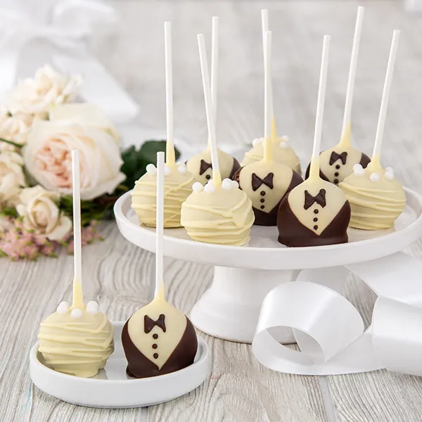 Wedding Cake Pops

The Bride wears a gown of imported Belgian White Chocolate, and the groom wears a white chocolate shirt with Belgian Dark Chocolate vest and a bow tie.
gourmetgiftbaskets.com/Wedding-Cake-P…