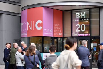 External shot of the entrance to Tonic Bankside with signage including 'this is how we live our lives out' 