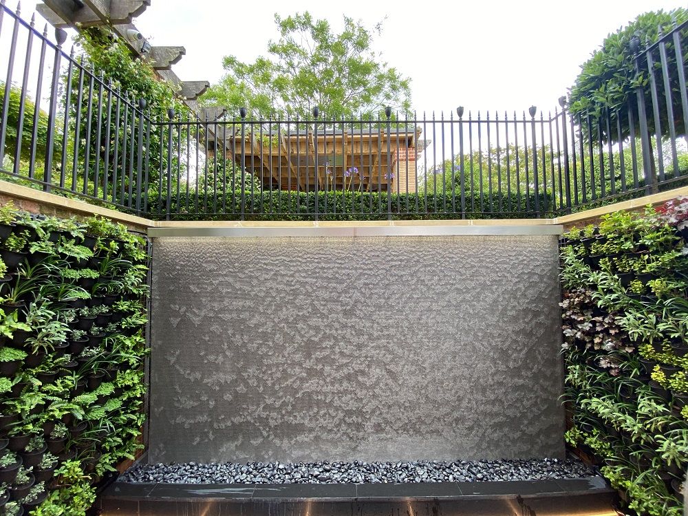 Living walls/green walls look compliment The AquaVeil water wall beautifully, but they also both improve a buildings air quality whilst green walls insulation keep them cool in the summer and warmer in the winter.