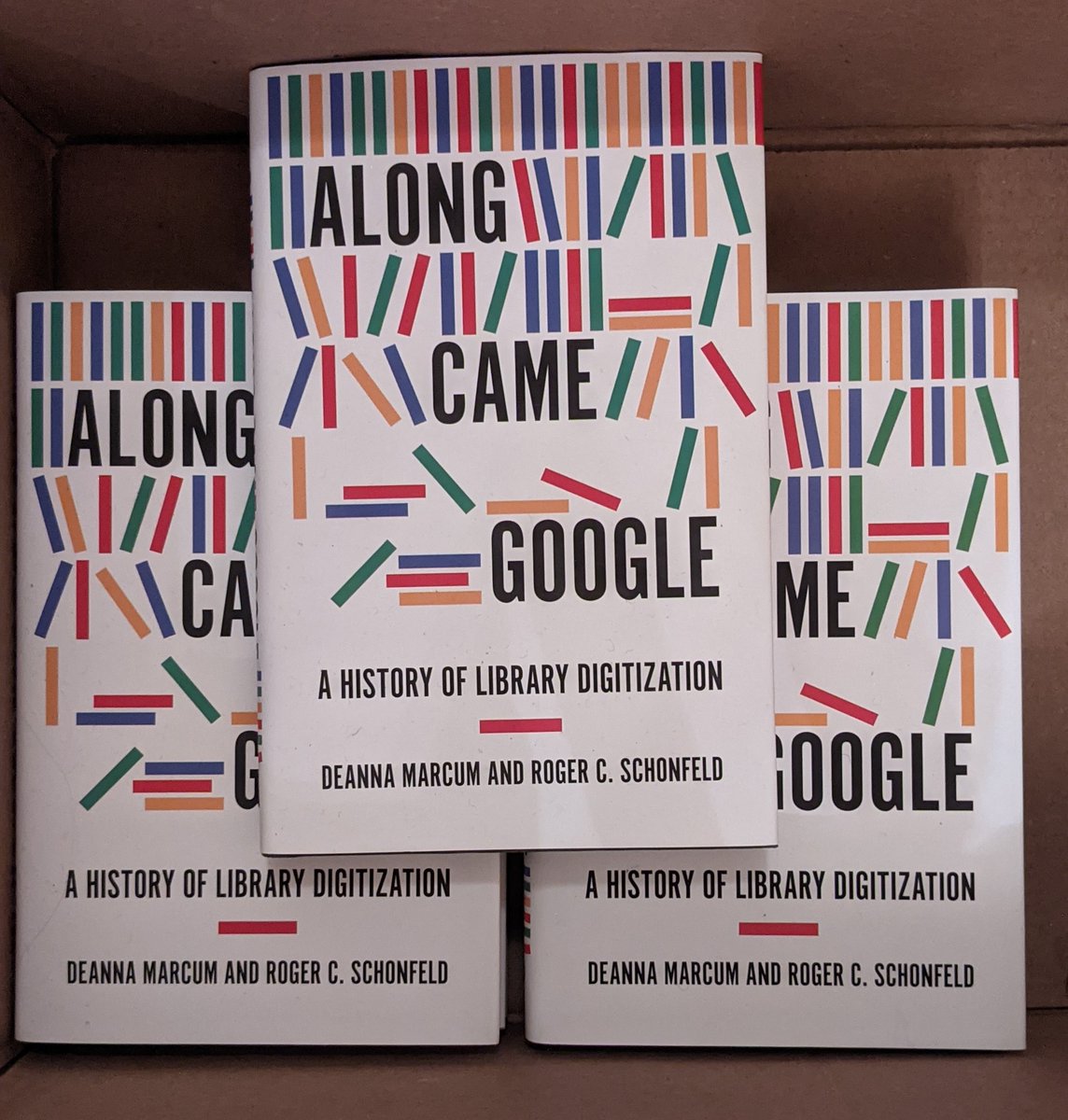 An unboxing of several hardcover copies of Along Came Google: A History of Library Digitization