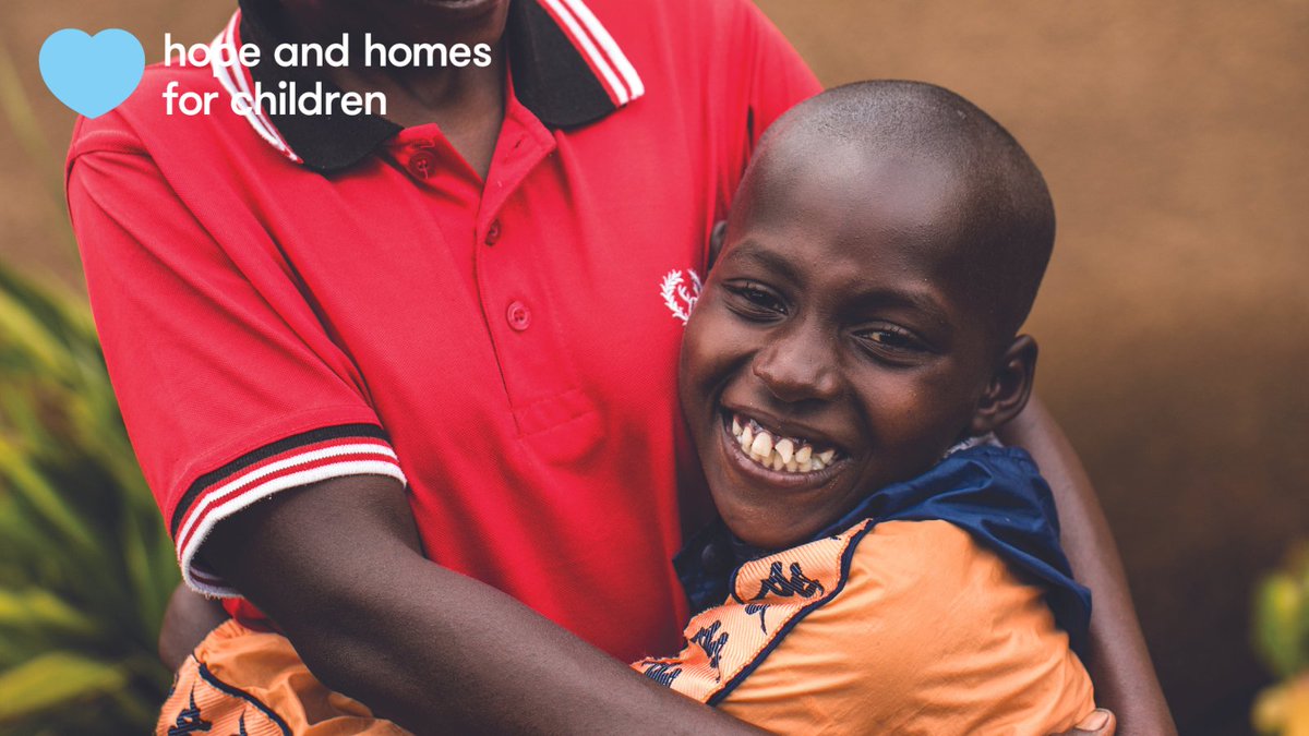 A child being embraced by a parent