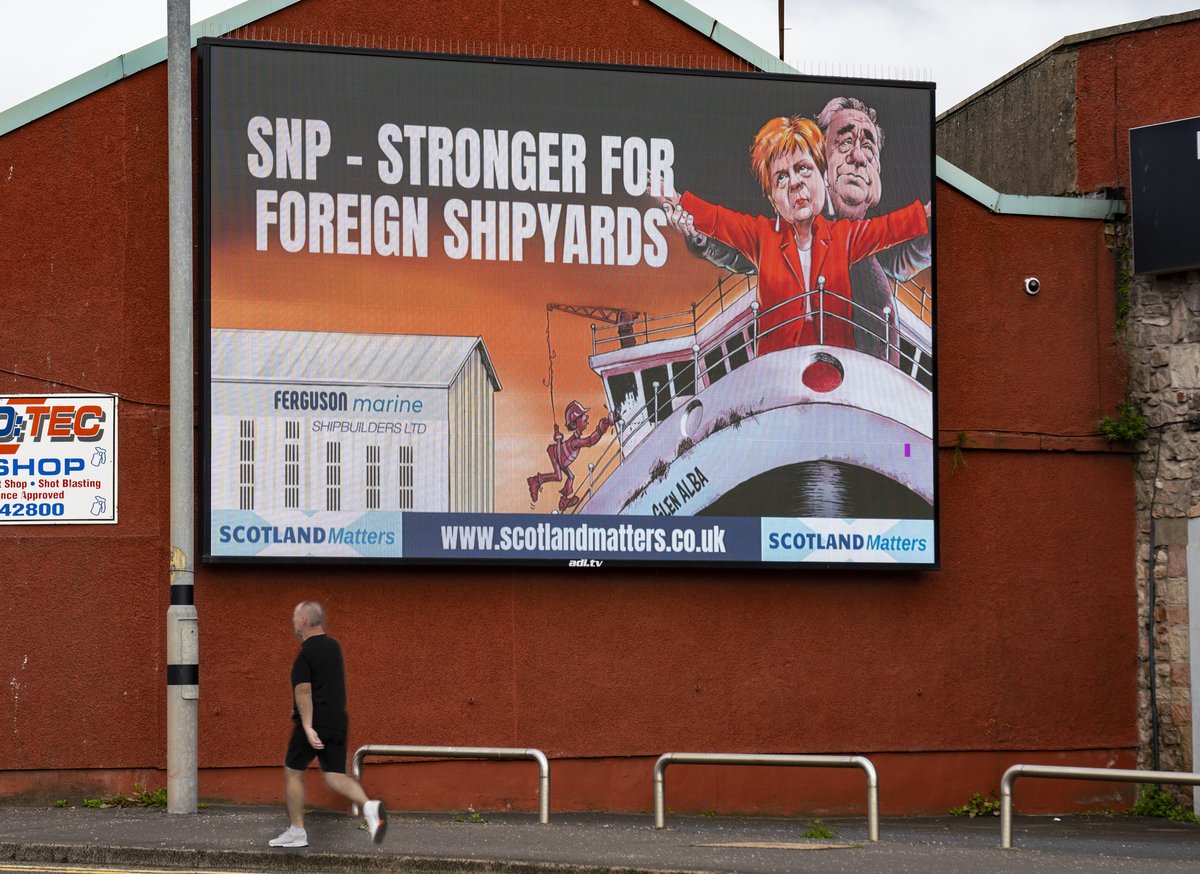 Billboard in Port Glasgow by @scotlandmatters a pro-Union group, attacking @theSNP for allowing foreign shipyards to bid for Scottish ferry contracts. @AlamyNews #shipbuilding #fergusonmarine @themajorityscot @CalMacFerries @scotgov  pics ; tinyurl.com/jan7x4hw