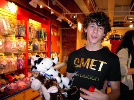 August 5, 2006: The Jonas Brothers performed at Faneuil Hall Marketplace in Boston, MA. Nick Jonas made a stuffed cow for Miley Cyrus at Build-A-Bear Workshop.