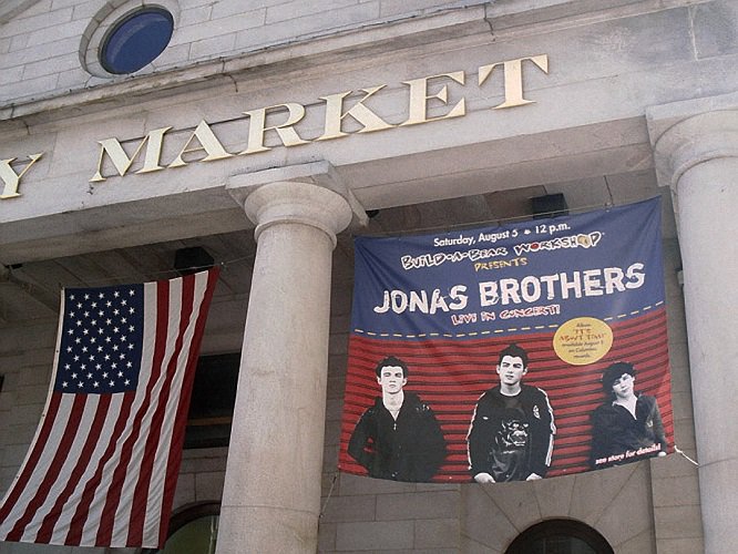 August 5, 2006: The Jonas Brothers performed at Faneuil Hall Marketplace in Boston, MA. Nick Jonas made a stuffed cow for Miley Cyrus at Build-A-Bear Workshop.