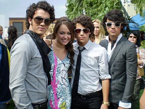 August 26, 2007: Miley and the Jonas Brothers attend the Teen Choice Awards together.