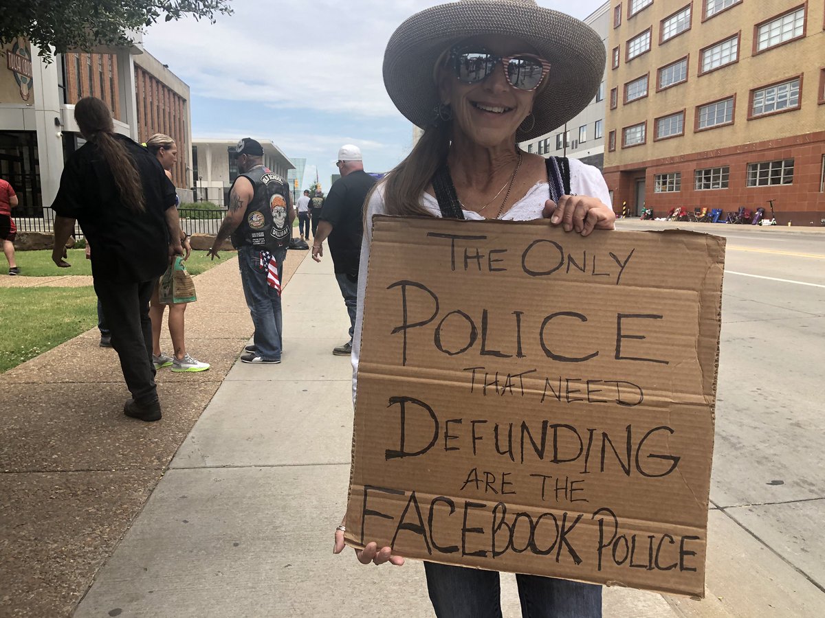 This woman tells me she wasn’t allowed into the Trump rally with her signs (no signs/flags are allowed.)Sign says “The only police that need defunding are the Facebook police.”