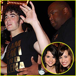 August 11, 2008: Kevin Jonas wore a “TEAM DEMI AND SELENA” shirt while out in New York City. The shirt was a reference to the online feud between Selena Gomez/Demi Lovato and Miley Cyrus/Mandy Jiroux.