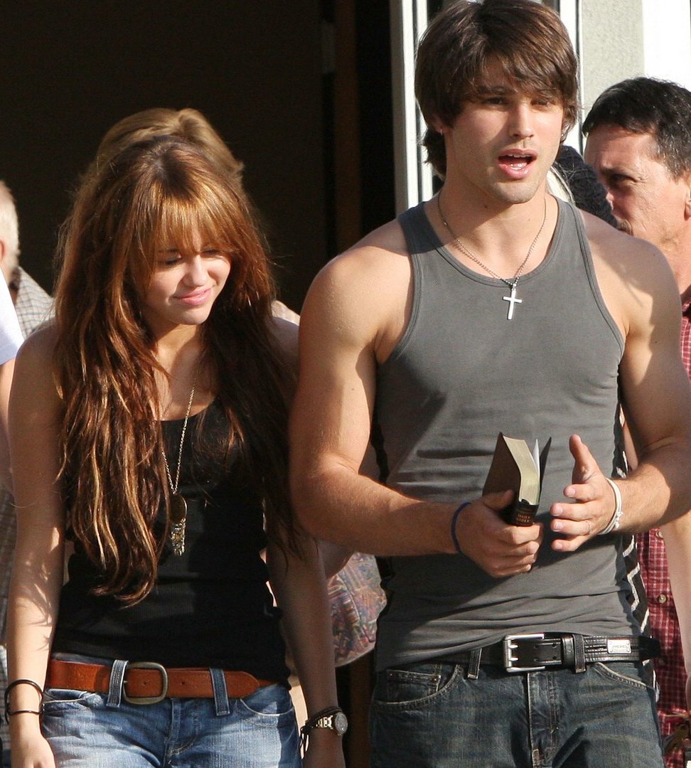 September 14, 2008: Miley Cyrus is photographed with new boyfriend Justin Gaston for the first time. They were photographed going to church with Miley’s family.