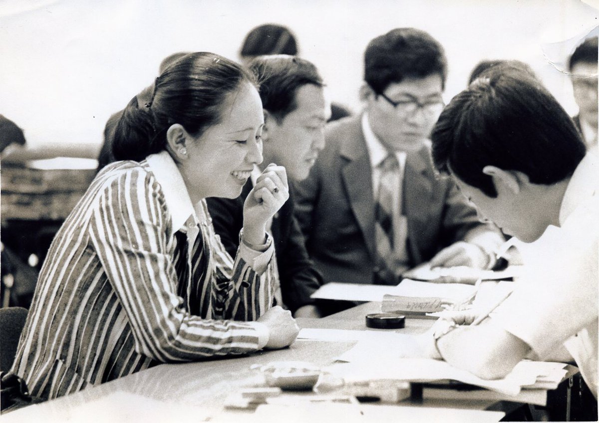 Here are more photos of Chinami I hope you will admire on this 10th anniversary of her passing.[Chinami pouring tea, Chinami laughing at a table with other people looking at papers, young Chinami appearing on tv, and young Chinami in a light green shirt looking at the camera.]