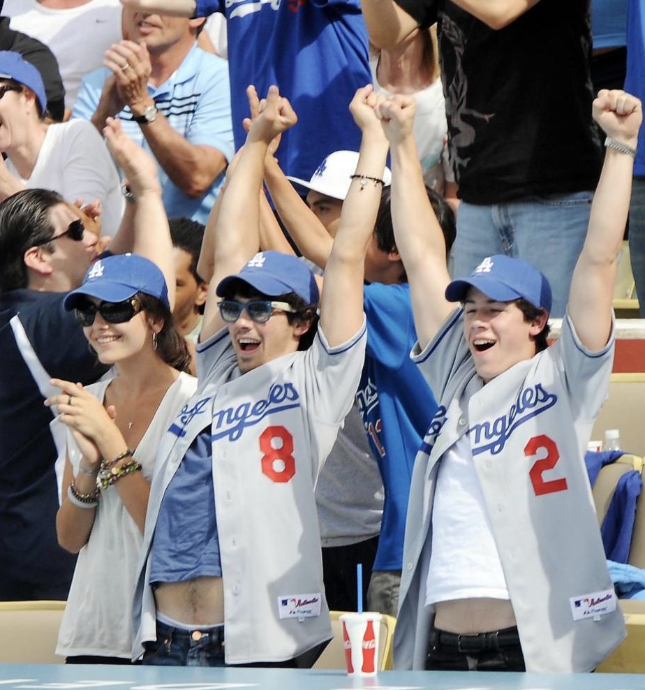 April 13, 2009: Nick Jonas attends a Dodgers baseball game. Miley tweeted about wishing she was there.