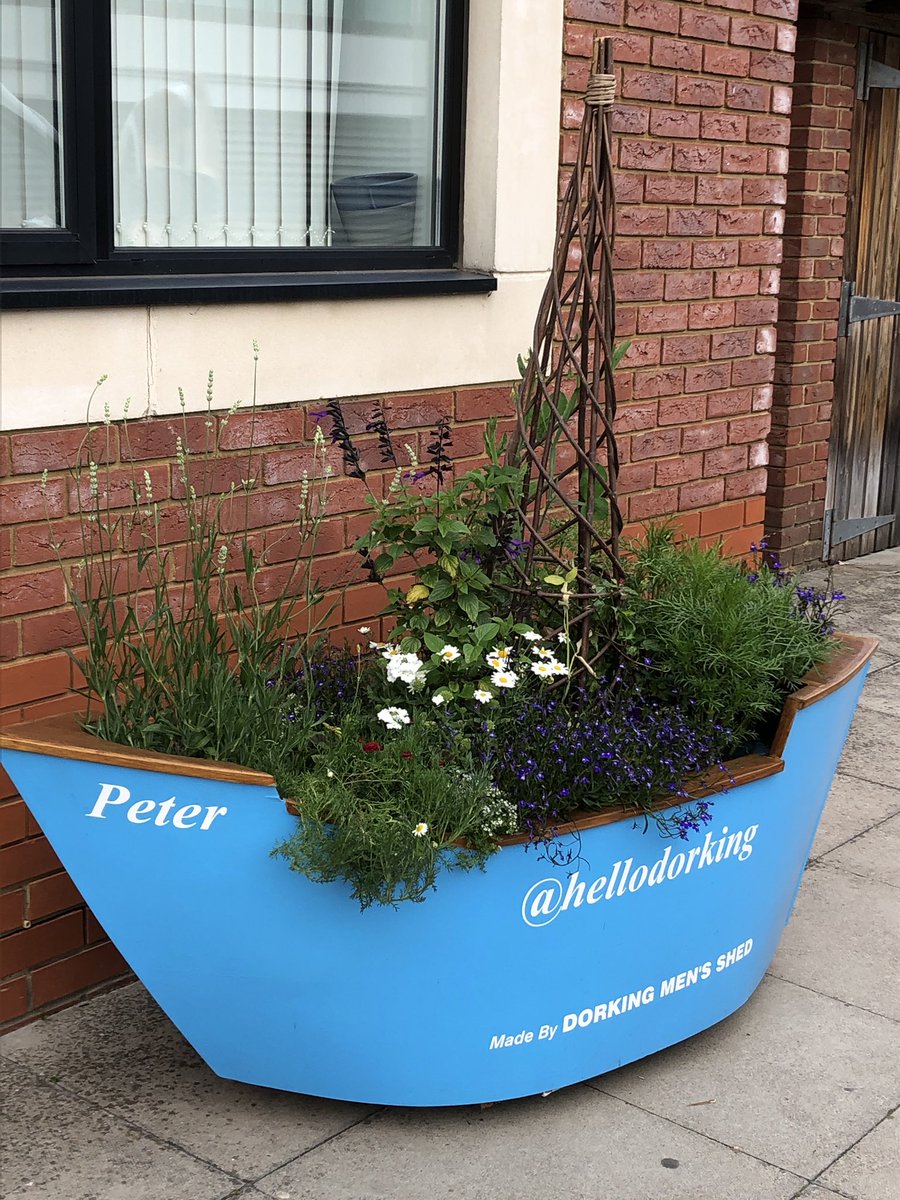 HelloDorking's tweet photo. We believe this is a great way to honour our #Dorkinian #heritage and #community #spirit which lives on today. The boats were made by Dorking Men’s Shed and the flowers were grown and planted by Patti Lister with the help of Elizabeth Fuller. Thank you for your hard work! https://t.co/INDsuXIvtC