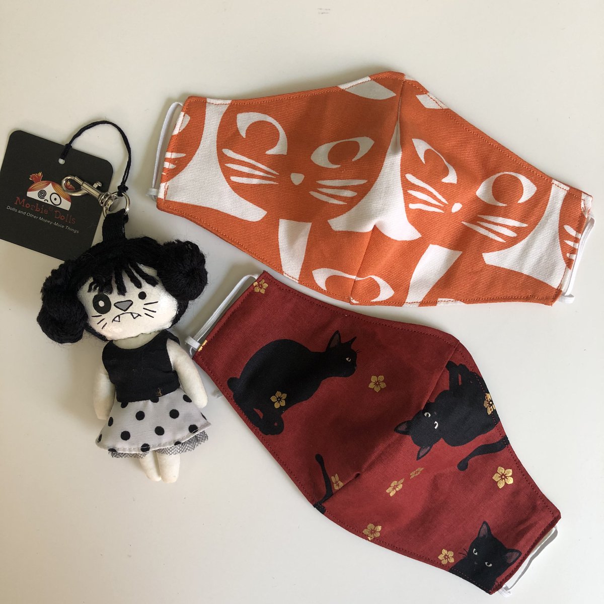 stitchesnscript's tweet photo. How may cats are there in this photo? Cat Meowsks! Morbiedoll Bag Charm on sale too! #meowsk #morbiedolls #cotton #fabricmasks #nonmedicalmask  #cats #madewithlove #madewithloveandspunk https://t.co/wT6iR9Jyb3