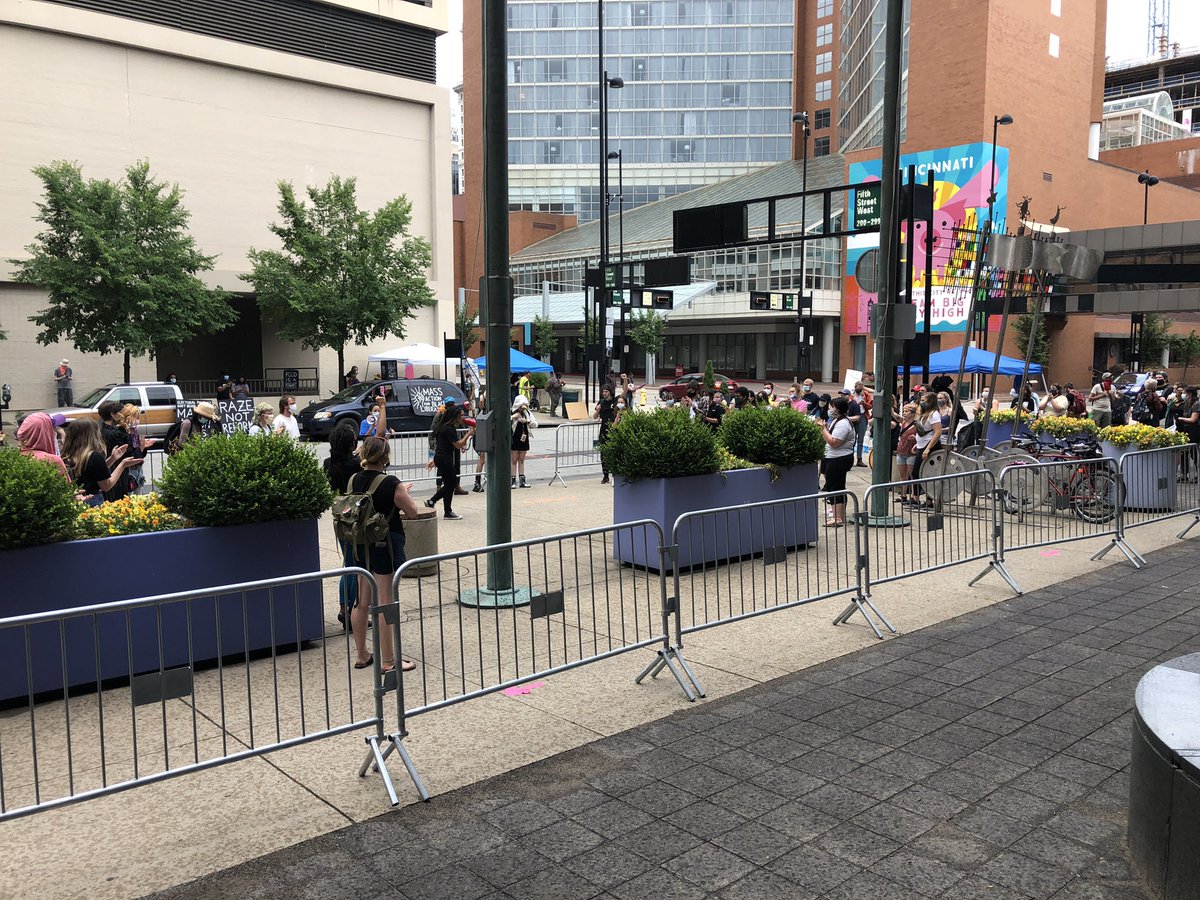 Now: Some people left the meeting and are outside preparing to march. Additional police officers are on standby outside. The informal hearing is still going on inside. They are not letting anyone else come in to  @DukeEnergy right now other than police and media.  @WLWT