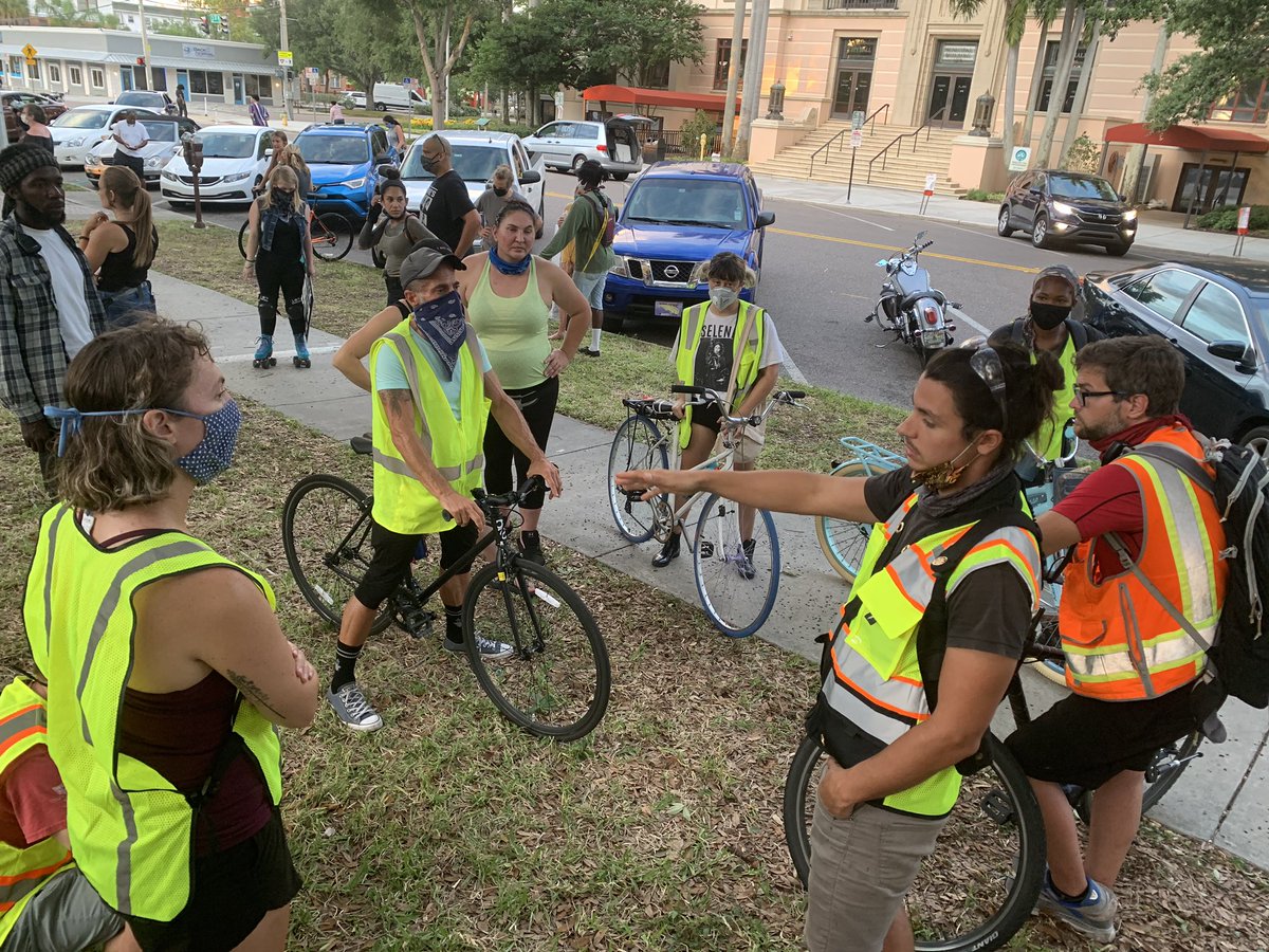 Operations leader Ian Tuma meets with the bike crew beforehand to brief them on the route and de-escalation. “The main goal is if there is an instigator, we want to keep protesters moving... there should really only be one person taking to the instigator.”