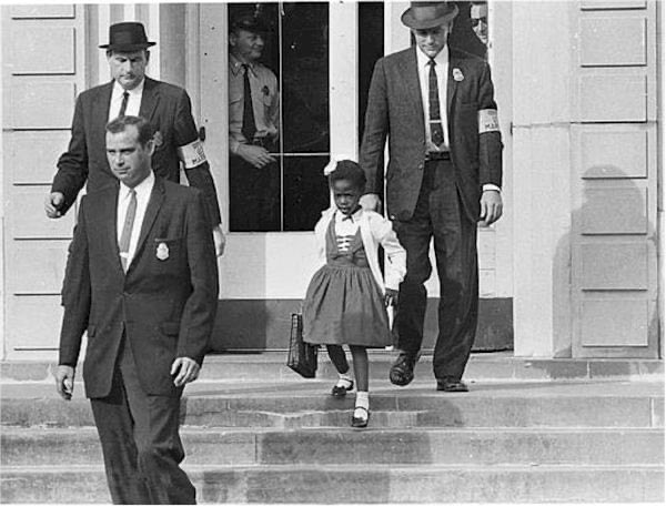 Never forget when Ruby Bridges integrated her elementary school a white woman woman held up a black baby doll in a coffin & another white woman threatened to poison her.The entire school year Ruby was only allowed to eat food that she brought from home, for her own safety.