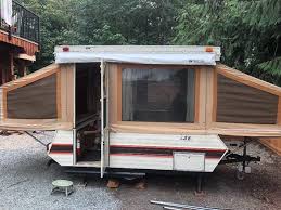 (For those of you unfamiliar with the technological marvel that is the tent trailer, it’s a big box. When it’s time for bed, you take a tool called “the crank” and wind the box open to make a hard-topped tent. Genius. All the comforts of home, if your home were a tent in a box.)