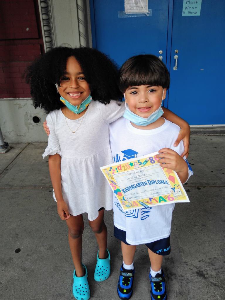 Kindergarten friends say hello and goodbye when they picked up their diplomas today!