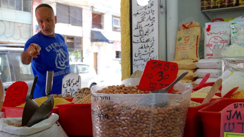 Behruz Baradarian was born in Iran. He fled Iran after the Islamic revolution in 1979. He has a shop and sells dry goods and spices. Behruz regrets that he cannot visit the place of his birth. He is one of over 130,000 of Iranian descent living in Israel.