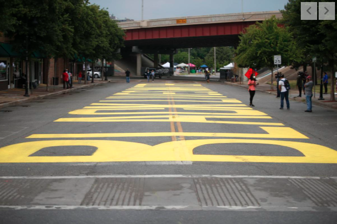 GingersnapDamo's tweet photo. 'Black Lives Matter' painted near the corner of Archer Street and Greenwood Avenue in the Greenwood District (aka Black Wall Street) of downtown Tulsa ahead of Trump rally tomorrow. #BlackLivesMatter #blmTulsa #TulsaRally #TulsaProtest #Juneteenth2020 #JuneteenthDay #Juneteenth https://t.co/IbFKStC9DG