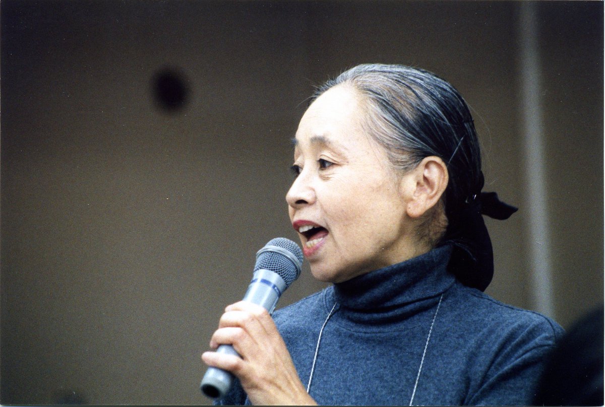 I’ve been thinking about how to hold onto the legacy of the High Treason Incident 100 years later and carry it with me in movements going forward. [photo of Chinami Kondo with her hair pulled back, speaking into a microphone.]