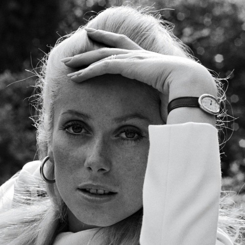 Catherine Deneuve, hand on head