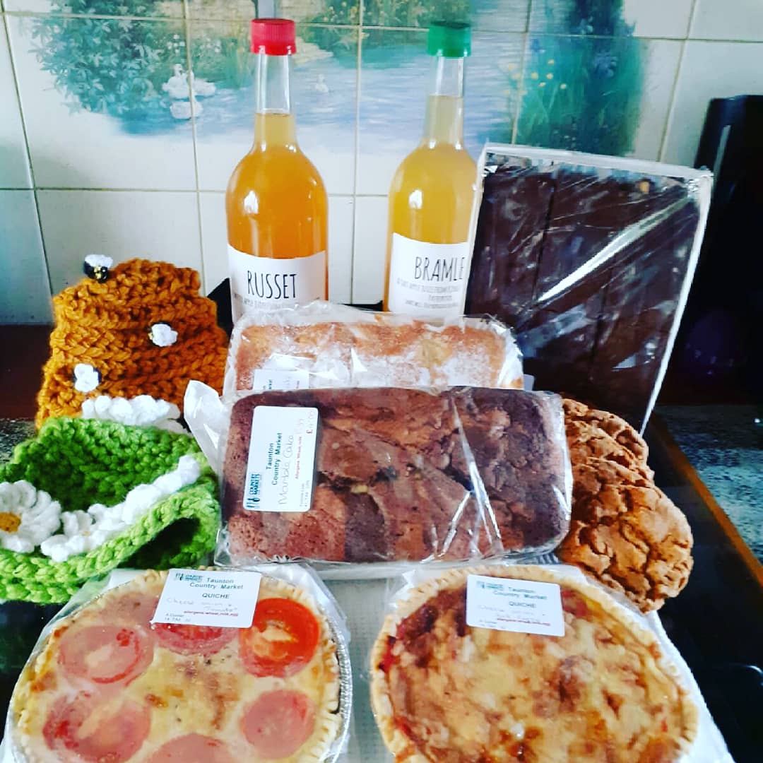 bealesteven45's tweet photo. Our #fridaynight #homedelivery from the lovely ladies at @Tauntoncmkt @BathPlaceTA1 #Taunton have arrived with this beautiful order all #homecooked support #localproduce #smallbusiness #freshfood #crafts #beehive #whitedaisles #teacossies #cake #buiscuits #applejuice #quiche https://t.co/AdveIG5BQm