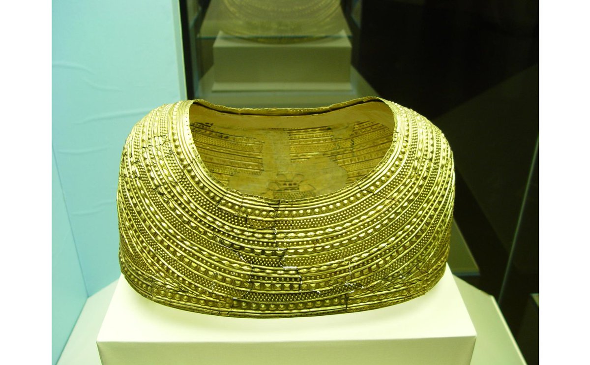 The "Mold Gold Cape" is now housed at The British Museum, London. More    https://www.britishmuseum.org/collection/object/H_1836-0902-1  https://en.wikipedia.org/wiki/Mold_cape   http://www.bbc.co.uk/ahistoryoftheworld/objects/okZT5JiCTn6lYFR0Gs9Tbg  https://www.atlasobscura.com/places/mold-gold-cape