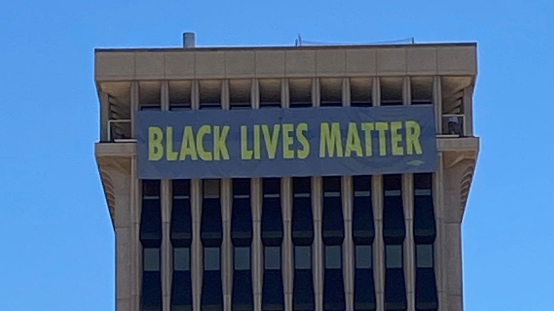 TucsonRomero's tweet photo. Today, we commemorate #JuneteenthDay and the ending of slavery in the US. 155 years later, systemic racism and oppression still pervade our society at every level.

This morning we unveiled a short but critical message from the 10th Floor at City Hall: #BlackLivesMatter https://t.co/88fflvwfFf