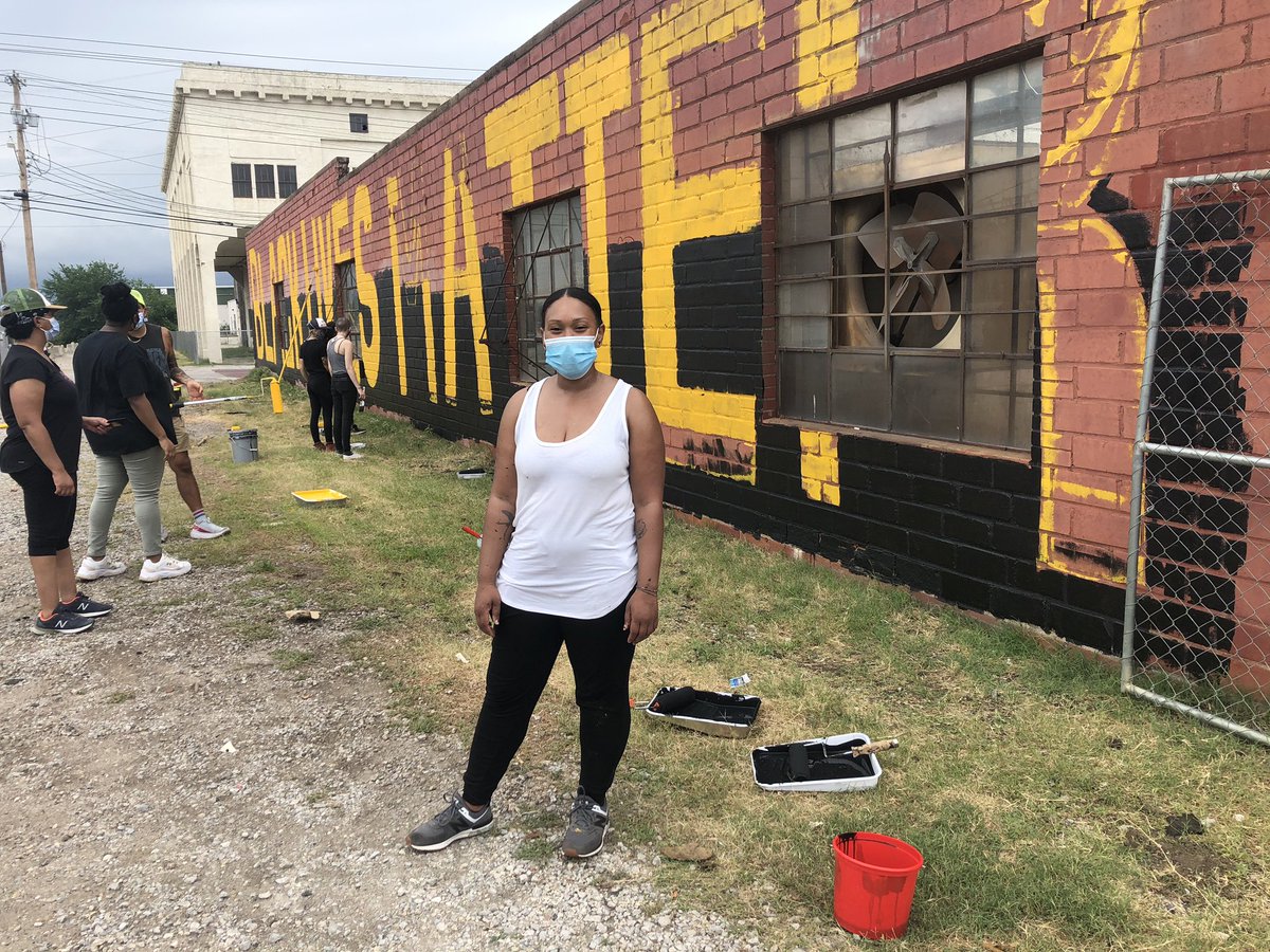 Elizabeth Henley, a member of the Black Moon art collective in Tulsa, is leading an effort to paint “BLACK LIVES MATTER” on the side of a building, not too far away from the BOK Center.