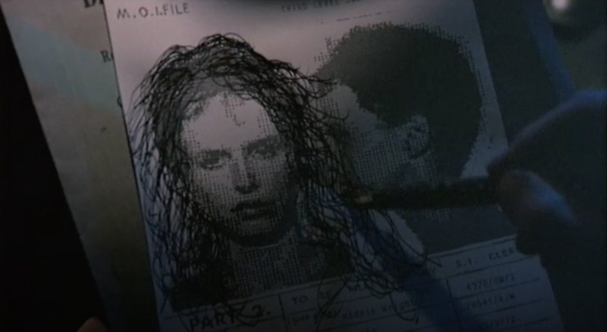 The tinest, most cutting in-film indictment of his dreamy character is the scene in which he is riding the weird tram-box home, drawing long, fantasy hair on his Jill print-out, going off into one of his weird reveries of chivalric-heroic rescue of the distressed damsel.