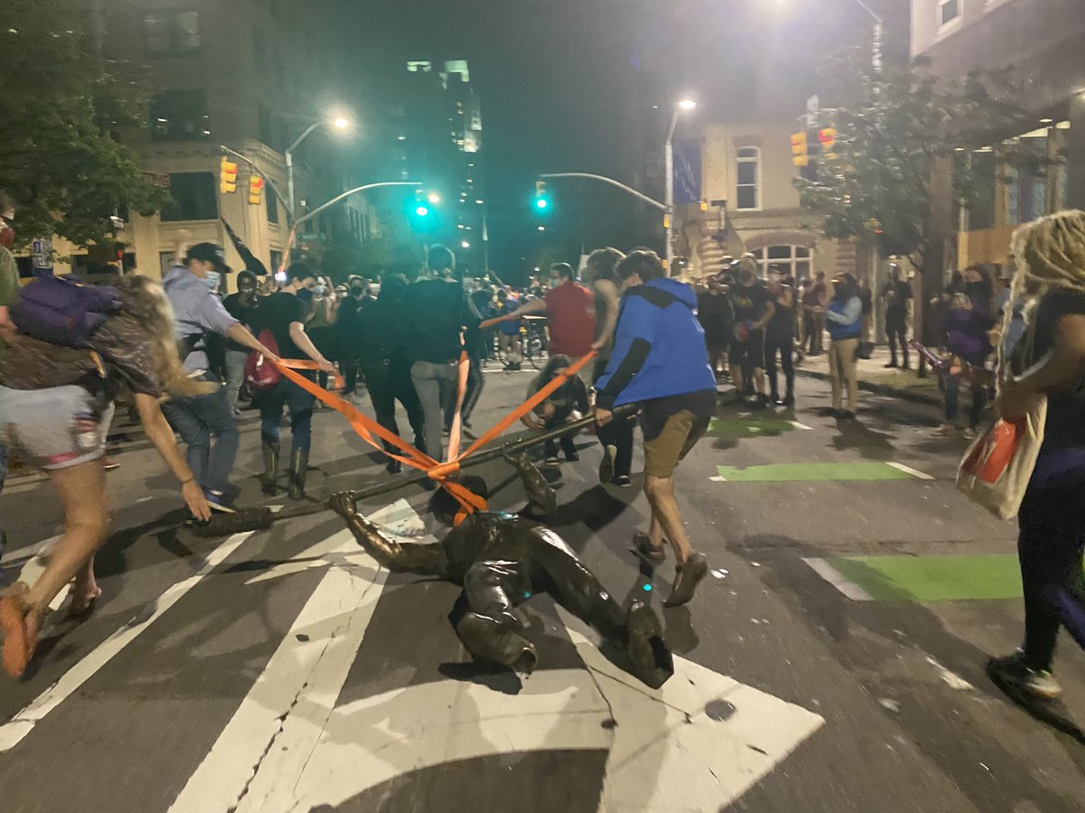 Leigh Tauss on Twitter: "Protesters are now dragging one of the ...