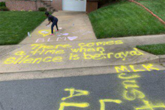 To give you a sense of it, here is a picture a neighbor took of the child in the middle of creating the art. I believe they were about done when this was taken.