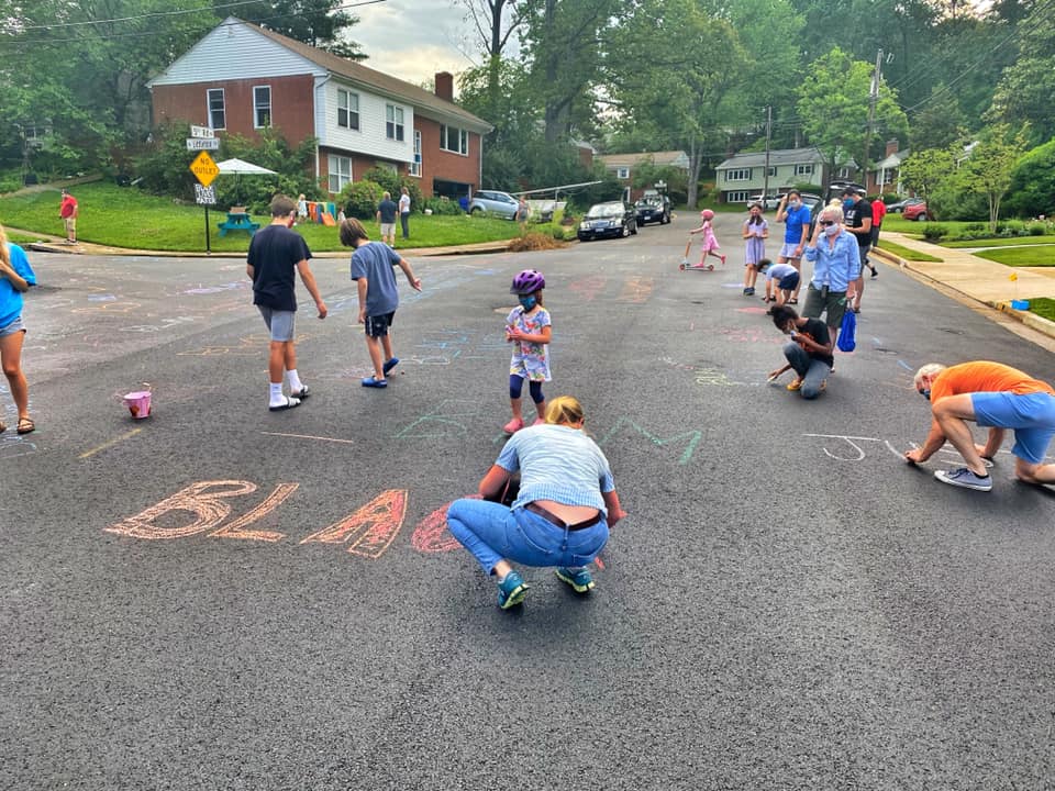 Supposed to rain overnight and neighbors already committing to just chalk more again tomorrow.Here are a few more of the scene of neighbors chalking up the street which was powerwashed: