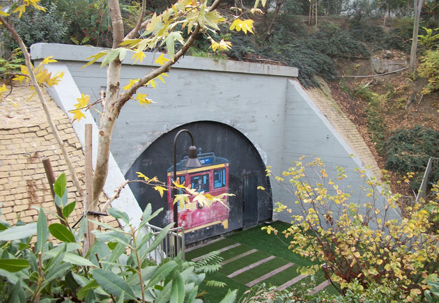 The opposite end of the tunnel was sealed in 2007 to make way for, coincidentally, another apartment complex - Belmont Station, built in front of the tunnel on the former Toluca Yard site. The power substation remains & a Red Car mural appears on the wall covering the tunnel.