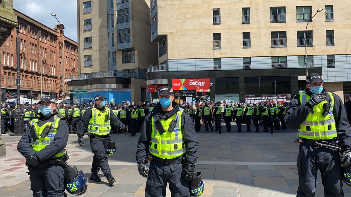Clear ground between cops as they force protesters across the road. I’ve been told I can stand here - far away from those being kettled