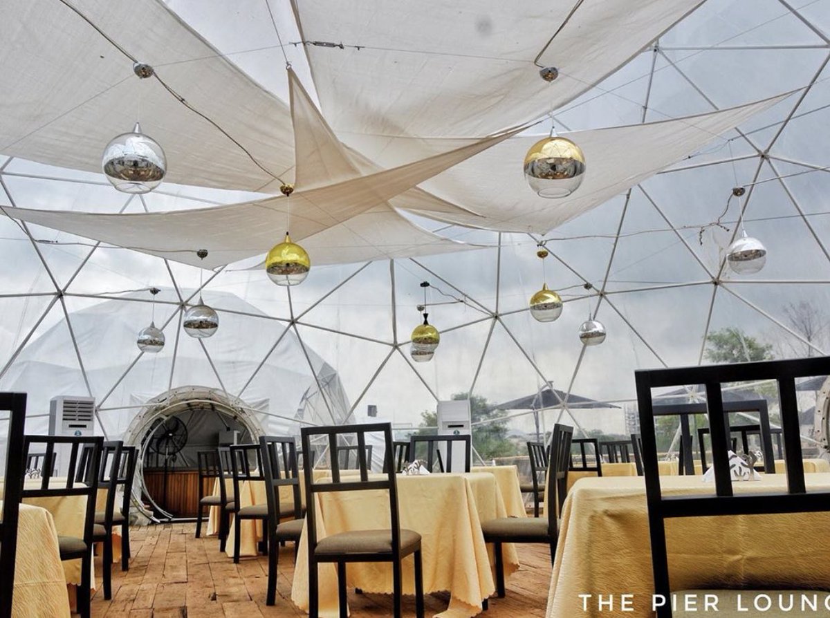 PIER RESTAURANT AND LOUNGE .The layout of this restaurant is different from your usual Abuja spot. The igloo like tents are captivating. Imagine going on a date on a rainy day and being able to watch drops of rain splash on d tent or stare at the stars on a dark night. Amazing!