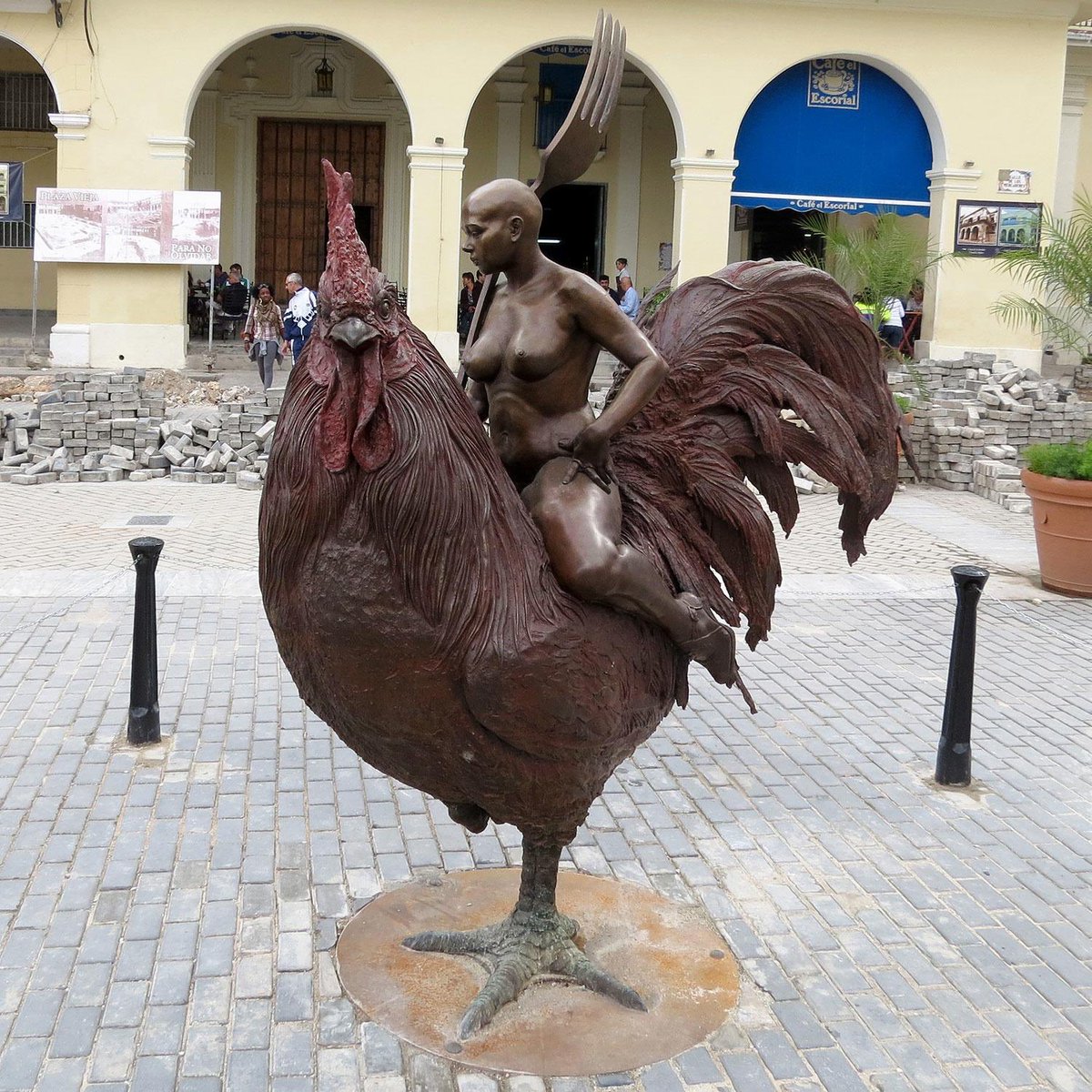 This statue is by Roberto Fabelo. No one knows what its called, or what is actually going on here, but this piece of art is currently on display in Cuba.