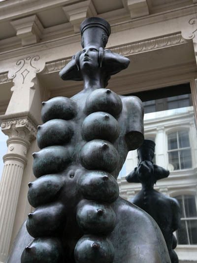 This New York statue is Cybele by Russian artist Mihail Chemiakin. She has eight pairs of breasts, four pairs of buttocks, three animal heads and a human face.  http://www.artatsite.com/NewYork/details/Chemiakin_Mihail_Cybele_Prince_Street_contemporary_statue_art_at_Site_New_York.html