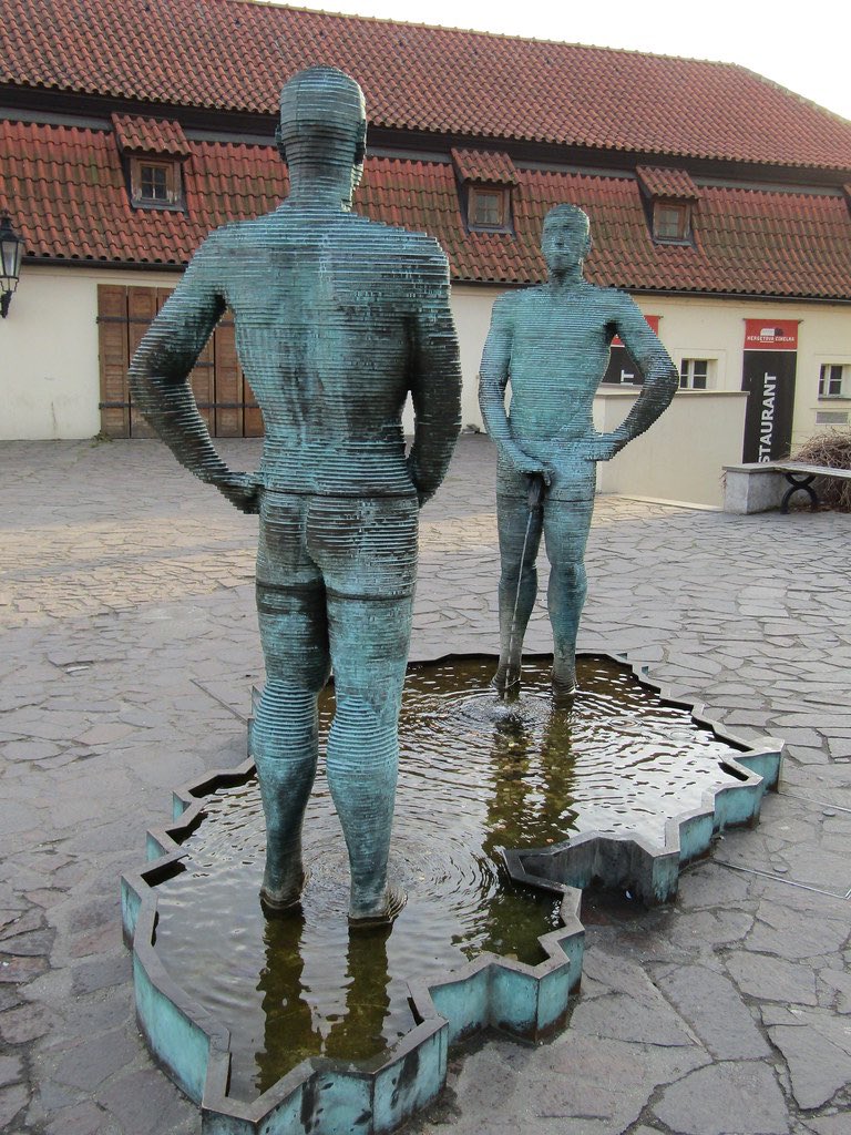 ‘Piss’ is an outdoor 2004 sculpture and fountain by Czech artist David Černý, installed outside the Franz Kafka Museum in Malá Strana, Prague, Czech Republic.