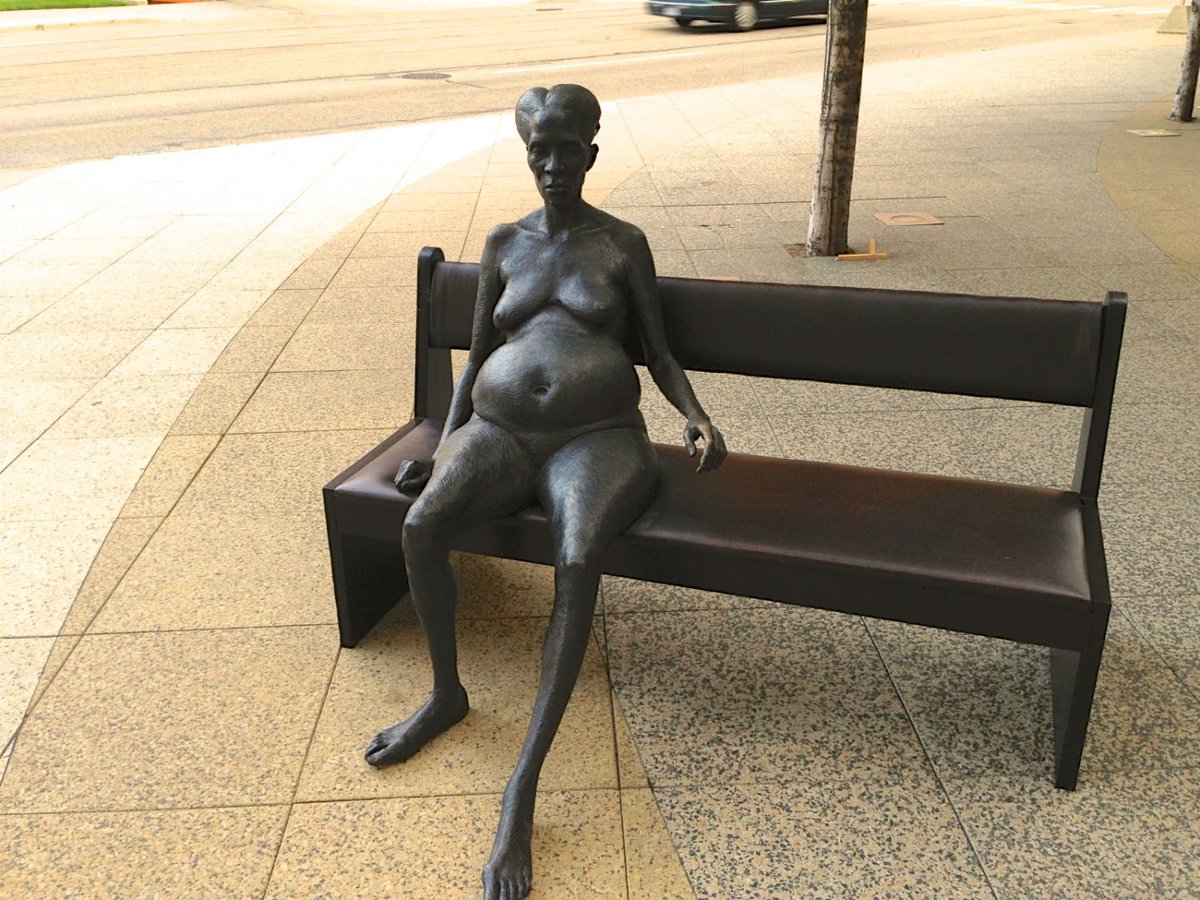 Nude woman on bench by Patrick McKearnan was installed in South Haven in West Michigan.