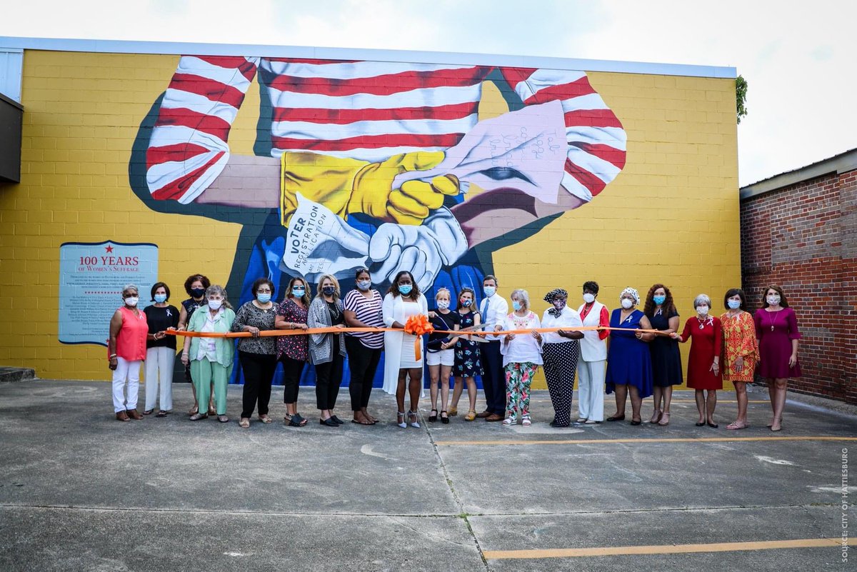 toby_barker's tweet photo. Special moment as we dedicated a @heidipitreart mural for the centennial of the 19th amendment’s ratification. The mural lists all women who have held elected office for @Hattiesburg_MS &amp; Forrest Co, many of whom attended. Thanks to HAPA &amp; the Edmonson Family for underwriting. https://t.co/Ej6vDeSTH6
