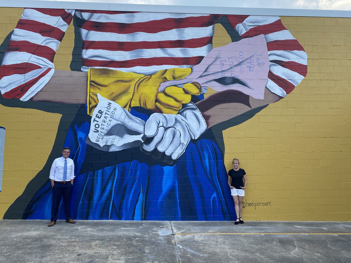 toby_barker's tweet photo. Special moment as we dedicated a @heidipitreart mural for the centennial of the 19th amendment’s ratification. The mural lists all women who have held elected office for @Hattiesburg_MS &amp; Forrest Co, many of whom attended. Thanks to HAPA &amp; the Edmonson Family for underwriting. https://t.co/Ej6vDeSTH6