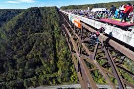 New River Gorge and bridge - Completed on 1977 and is the longest steel span in the western hemisphere and the third highest in the United States. Bridge Day is held here where BASE jumpers leap 876ft off the bridge. The New River is one of the oldest rivers on the continent.