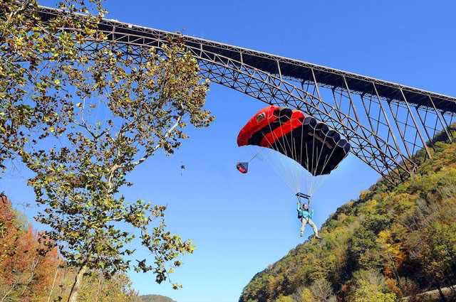 New River Gorge and bridge - Completed on 1977 and is the longest steel span in the western hemisphere and the third highest in the United States. Bridge Day is held here where BASE jumpers leap 876ft off the bridge. The New River is one of the oldest rivers on the continent.