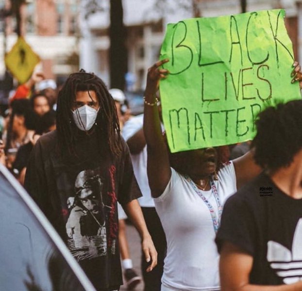 XXL's tweet image. Someone turned this picture of J. Cole protesting into an album cover