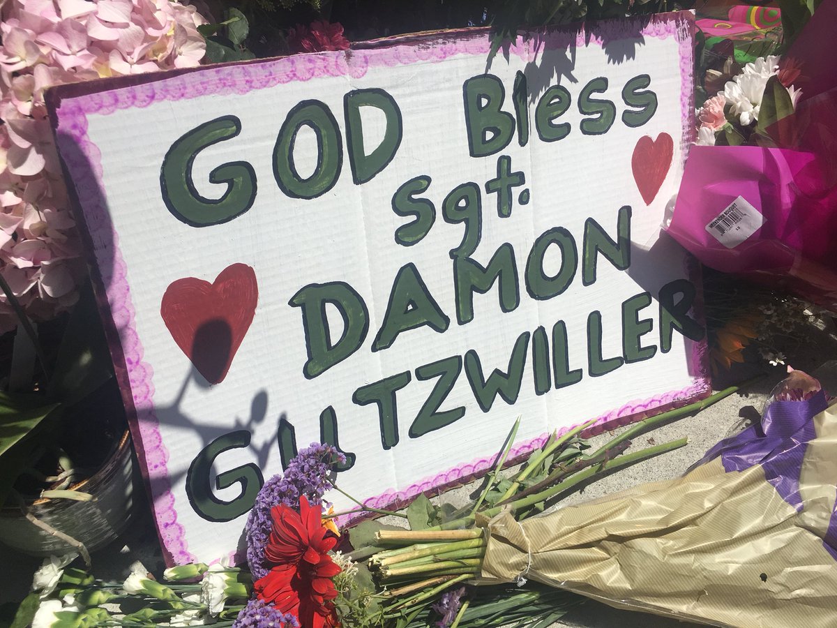 RFladeboe7's tweet photo. Memorial is growing in honor of slain #SantaCruzCo #DeputyDamonGutzwiller. Sheriff Jim Hart expected to provide new info (2 pm presser)about alleged ambush that led to Gutzwiller’s death. FBI is here looking at suspect #StevenCarrillo in connection with May 29 killing in Oakland https://t.co/T83Lu4iyRS